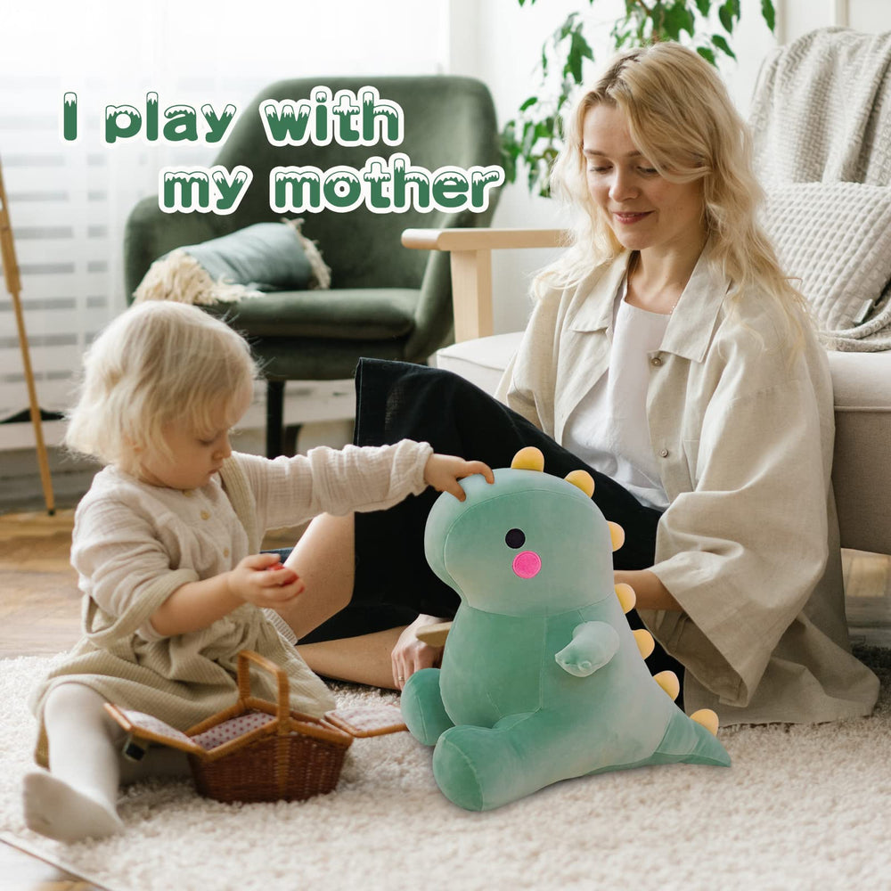 DUANMUL dinosaur plush used as bedtime pillow in green.
