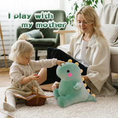 DUANMUL dinosaur plush used as bedtime pillow in green.