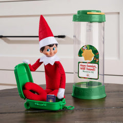 The Elf on the Shelf Collectible Tin Suitcase keeps outfits organized on the go.