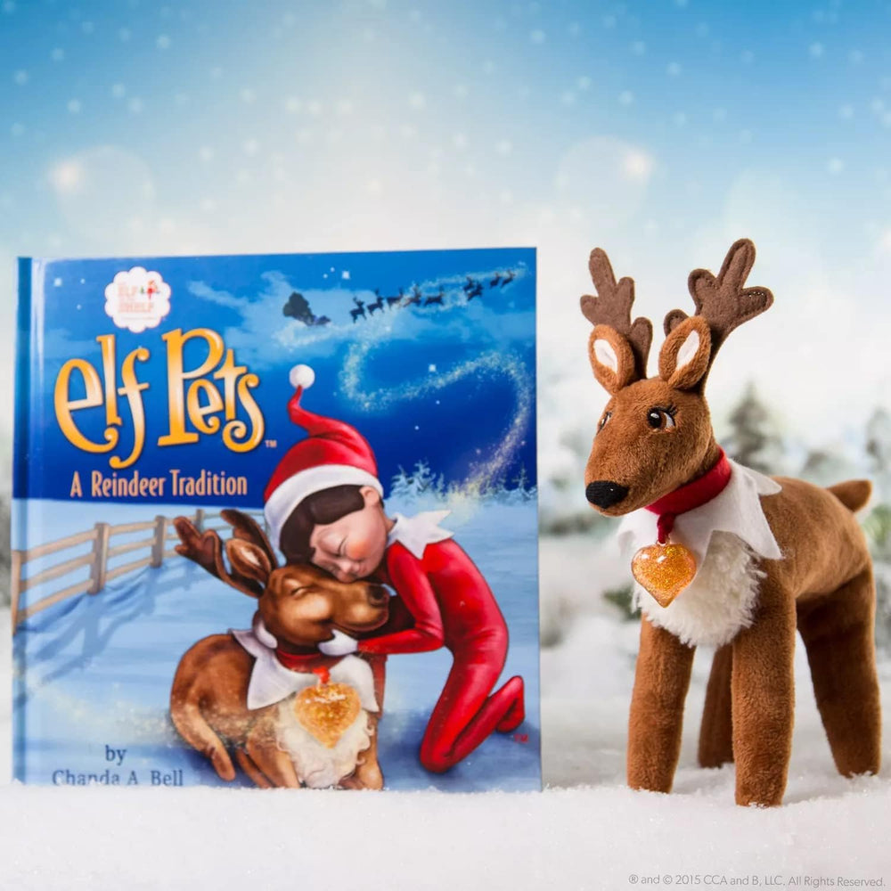 Reindeer plush with golden heart charm by The Elf on the Shelf.