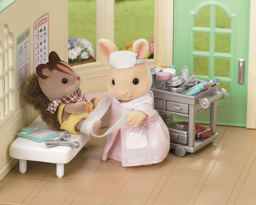 Epoch Nurse Set storage display helps keep dollhouse setups organized.