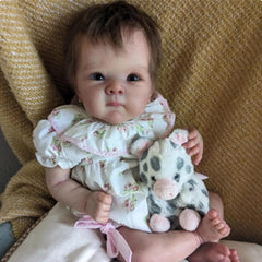 FASMAS Reborn doll floral dress detail showing realism and style
