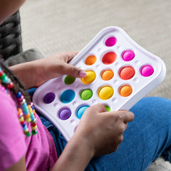 Fat Brain Dimpl Pops two bubble sizes shown to engage different hand movements.