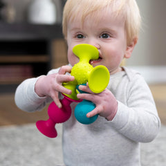 pipSquigz on a highchair engaging baby during a meal