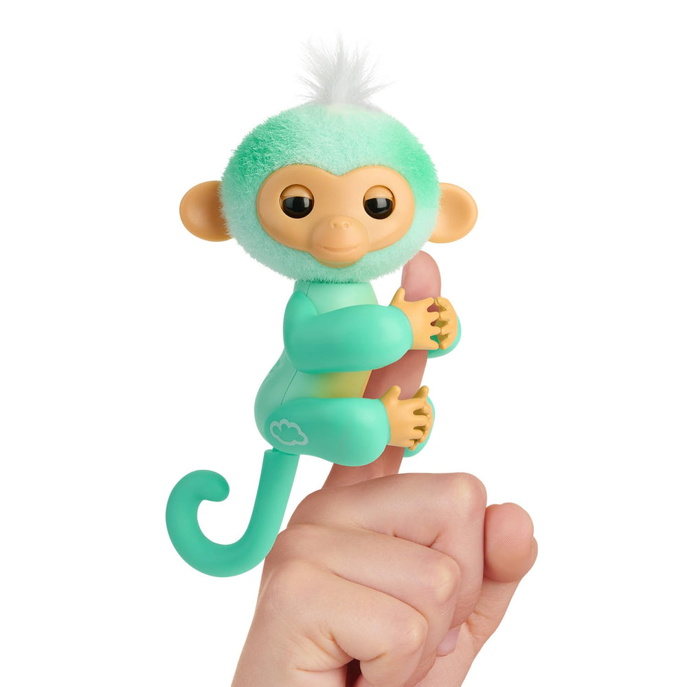 Fingerlings Ava on finger with heart glow, a cuddly companion for kids' imaginative play.