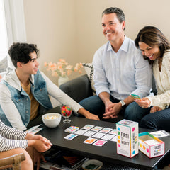 First to Worst game night moment captures playful banter and quick thinking among friends.