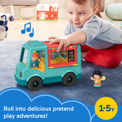 Fisher-Price Little People food truck outdoor dining area opens for pretend meals.