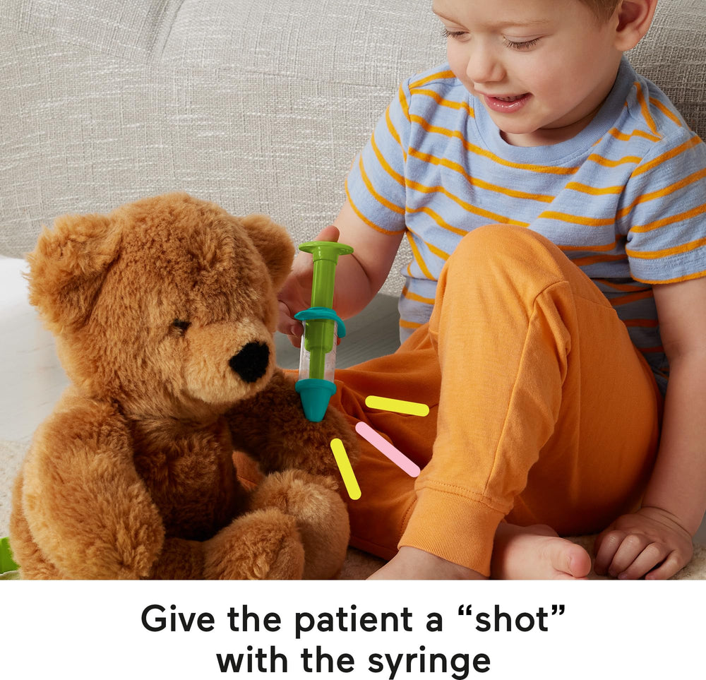 Fisher-Price syringe and bandage for comforting pretend injuries.