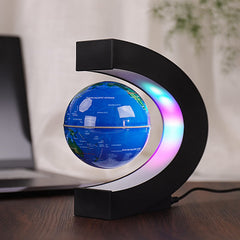 Forno C-shape levitation base showcases a blue glowing globe.