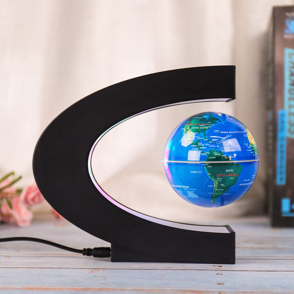 Forno globe rotation display with blue LED illumination at night.