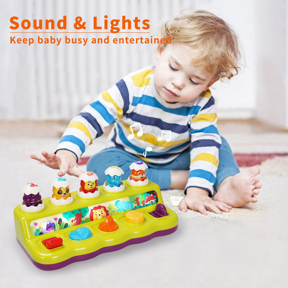 FS Toddler Pop Up Toy button closeup showing interactive controls and tiny animals
