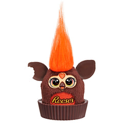 Furby Furblets Reese's cup display sits on a desk for playful decor.