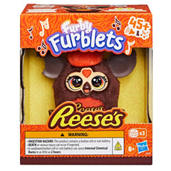 Furby Furblets top head button area emits amusing sounds during play.