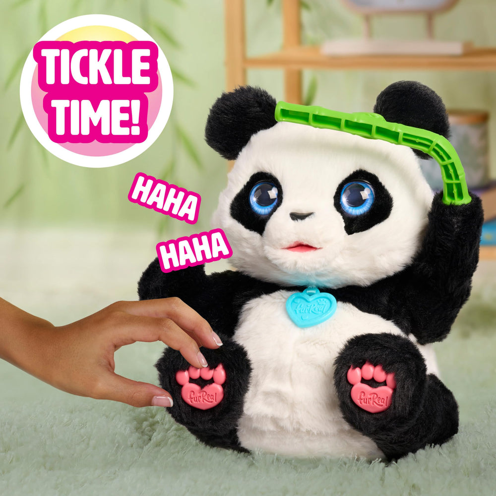 FurReal Coco holding bamboo shoot accessory to illustrate snacking sounds and role play