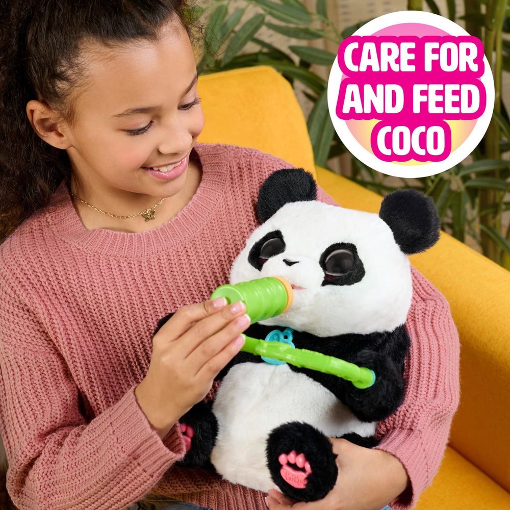 FurReal Coco beside a child to show 10.5-inch scale and hands-on play size