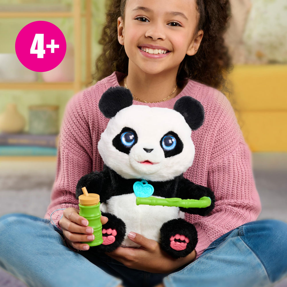 FurReal Coco captured mid-tumble demonstrating rolling motion and interactive fun