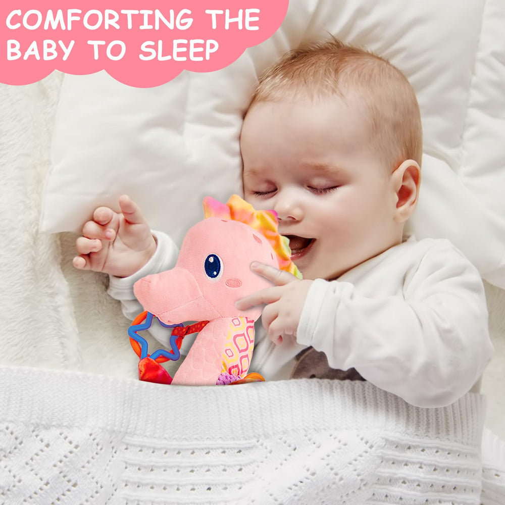 Baby holds the Fuzqq seahorse plush during play and cuddle time