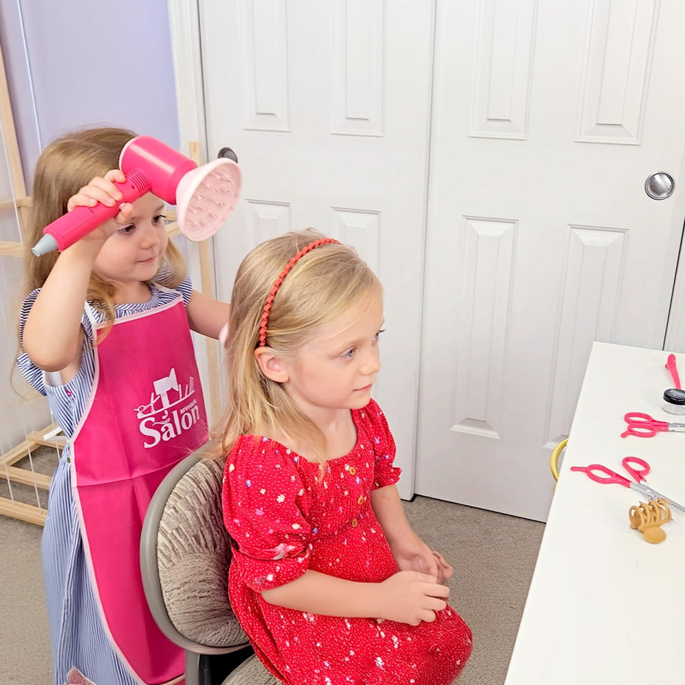 GAGAKU apron keeps children tidy while exploring beauty salon pretend play.
