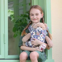 Front-facing carry option shown, supports nurturing pretend play and role assignment
