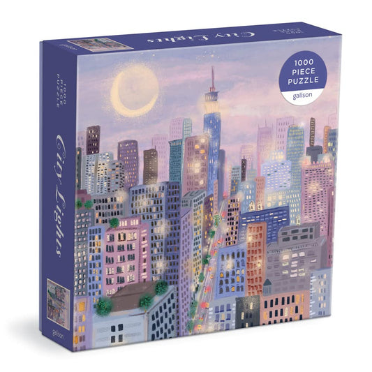 Galison City Lights puzzle box front shows lavender night scene, ideal for gifting.