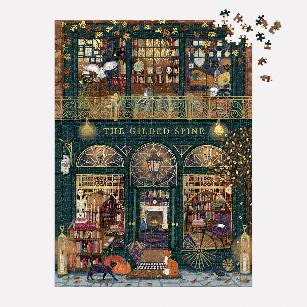 Galison puzzle insert and scattered pieces for easier assembly and reference