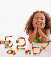 Ganowo Wacky Tracks snake toy for stretch, shape, and sensory exploration.