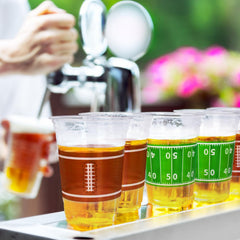 Gatherfun football cups stacked on display for easy party setup