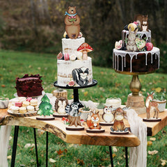 Geetery squirrel cutouts paired with greenery for stylish table decor.