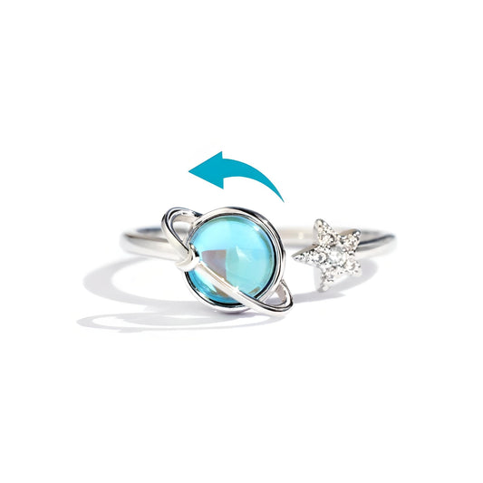 Generic spinning opal planet ring offers discreet stress relief during daily commutes.