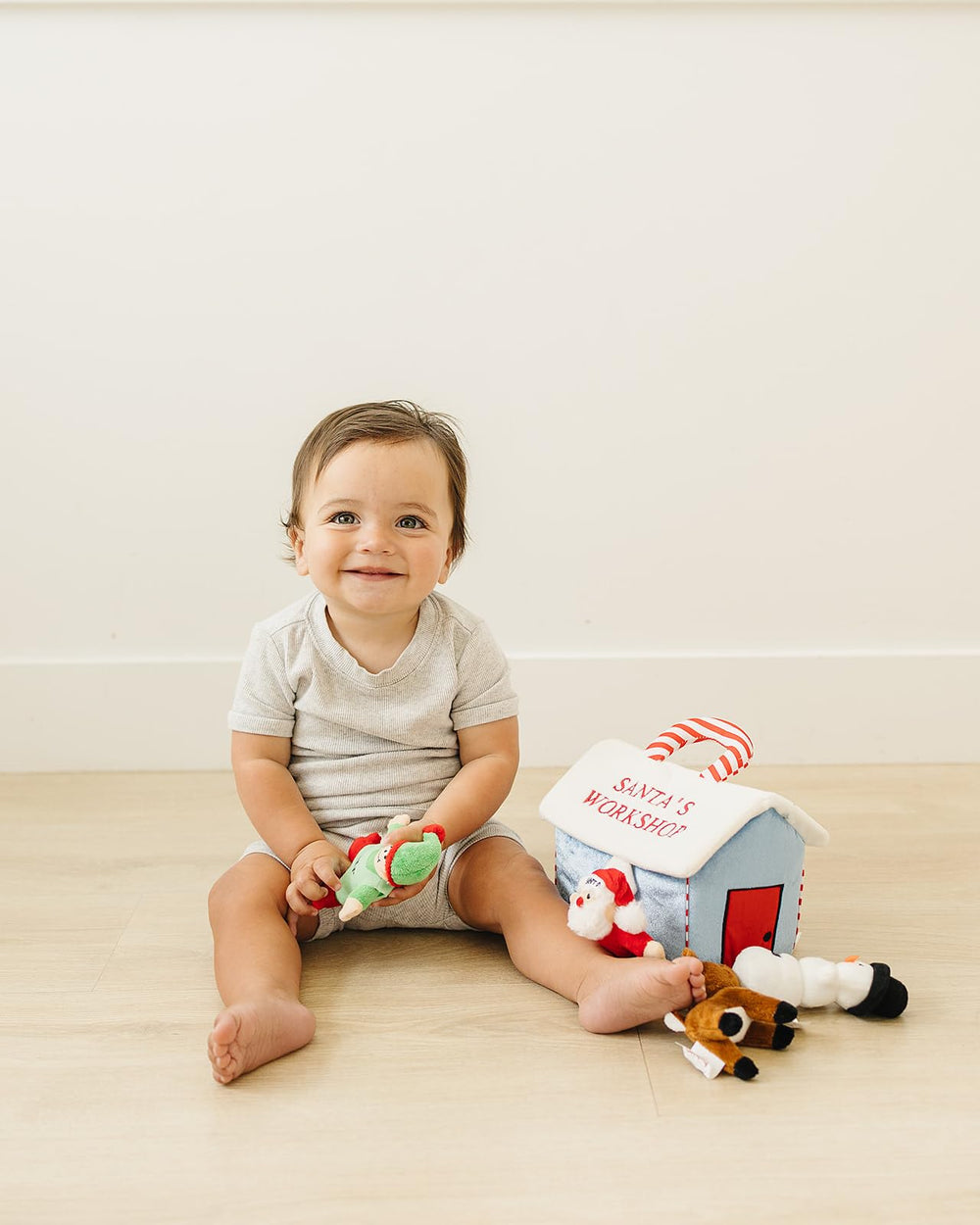 Genius Baby Toys My First Christmas Elf plush offers easy grasp and holiday themed tactile play.