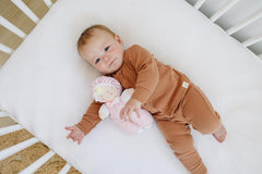 Genius Baby Toys pink hat and polka dot bow design for cute, cozy moments