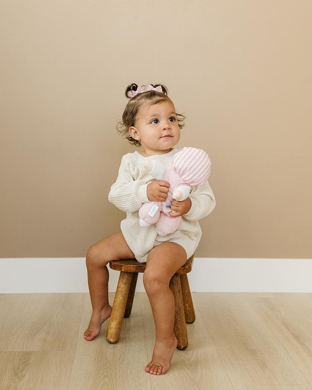 Genius Baby Toys smiling face doll invites gentle interaction and nurture