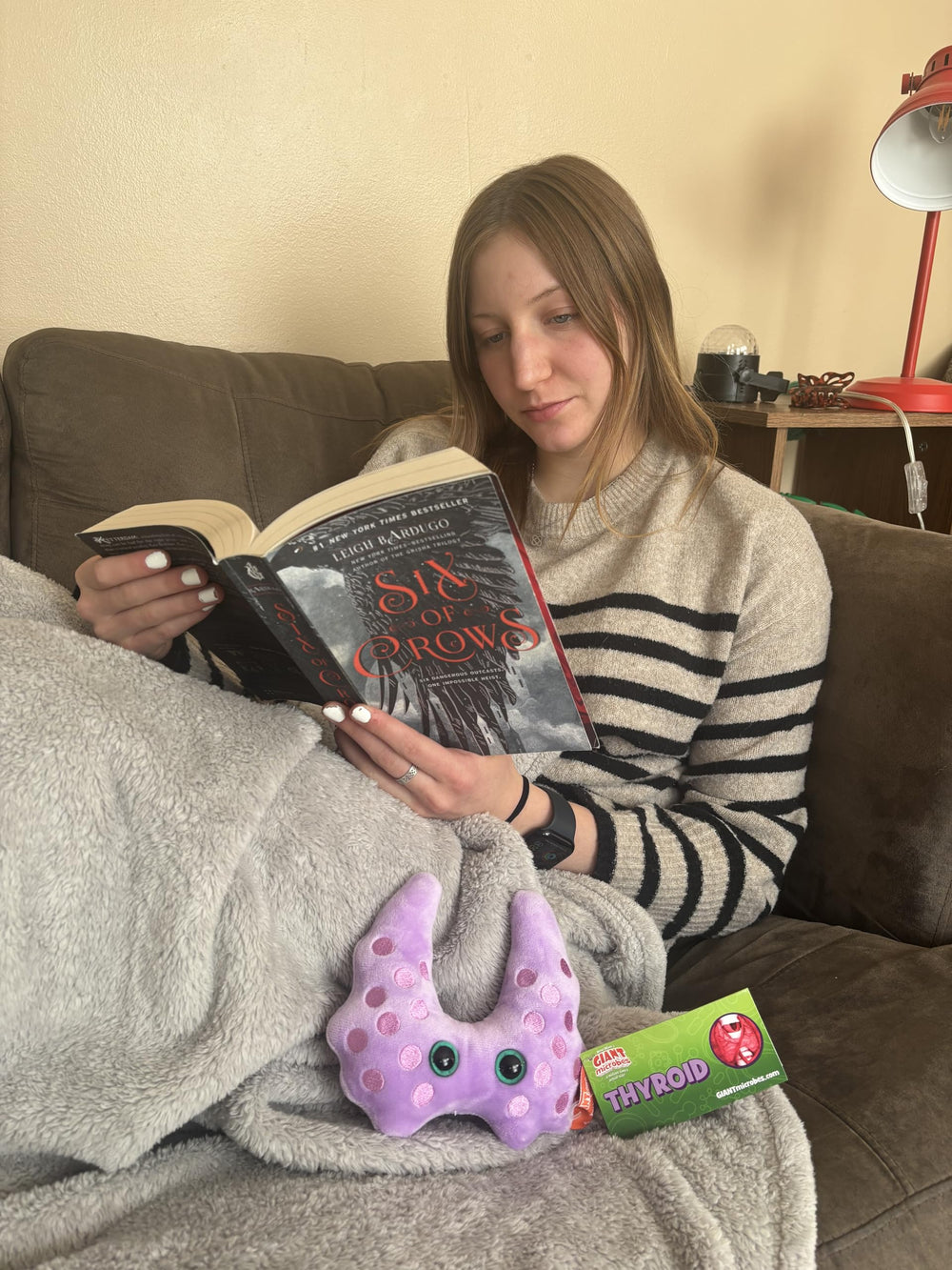 GIANT MICROBES Thyroid Plush beside an educational card and facts