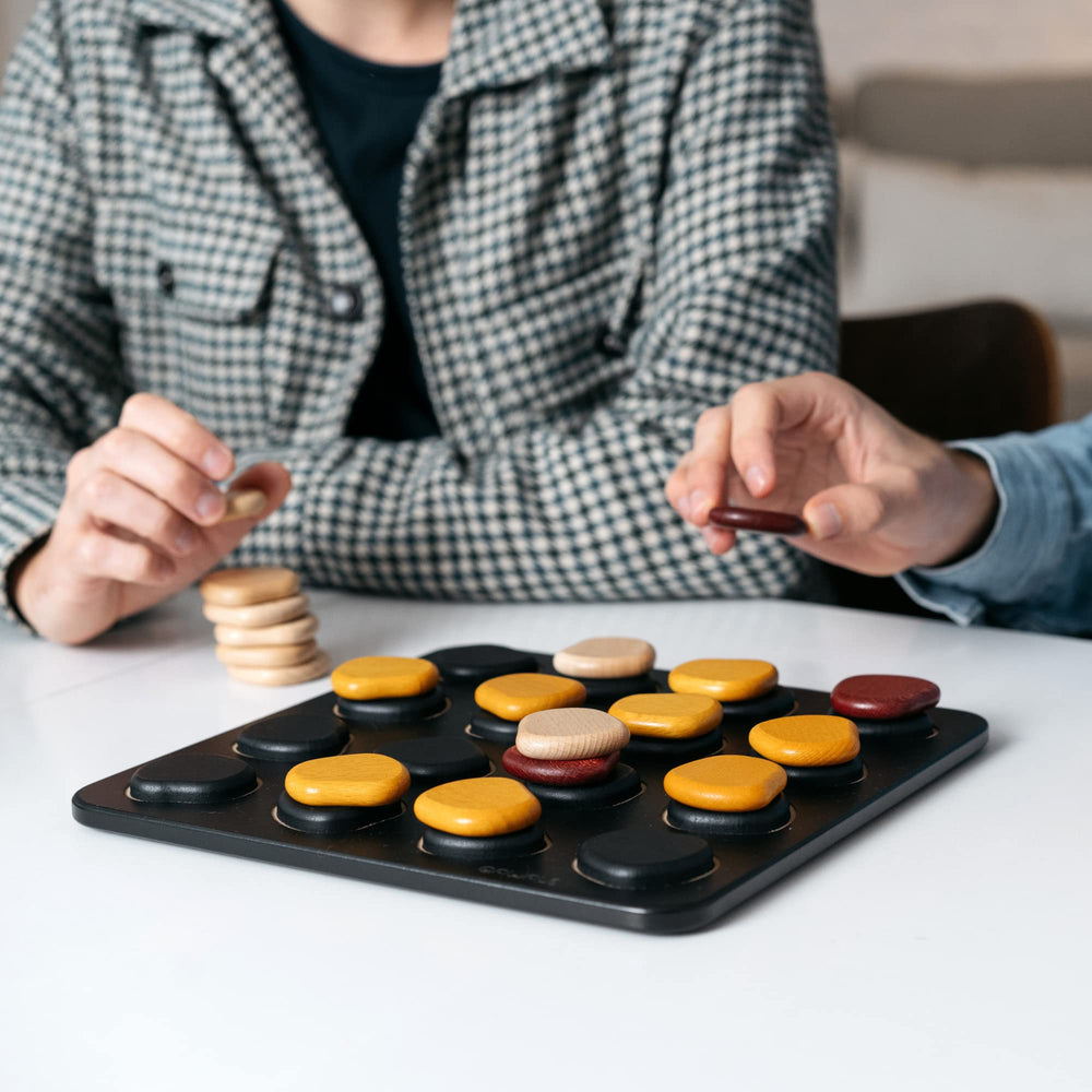 GIGAMIC Qawale 60-second rulebook illustrates quick learning for beginners.
