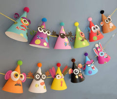 Glittery Garden reflective gold stickers brighten hats for standout birthday photos.
