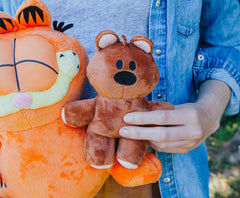Golden Bell Garfield plush features durable stitching for daily cuddles.