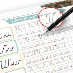 Adult learner refining cursive with Graceful By Design workbook and reusable ink.