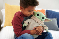 Mattel Grogu plush eyes blink when squeezed for interaction.