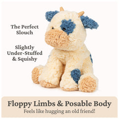 GUND Cozys Cow plush shows beige horns and a navy tail tuft for detail.