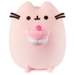 GUND Pusheen Cherry Macaron Squisheen plush holding a macaron for cozy play.