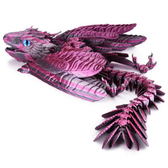 Guwewu Feathered Wyvern Dragon on a desk, showcasing detailed handcrafted craftsmanship.