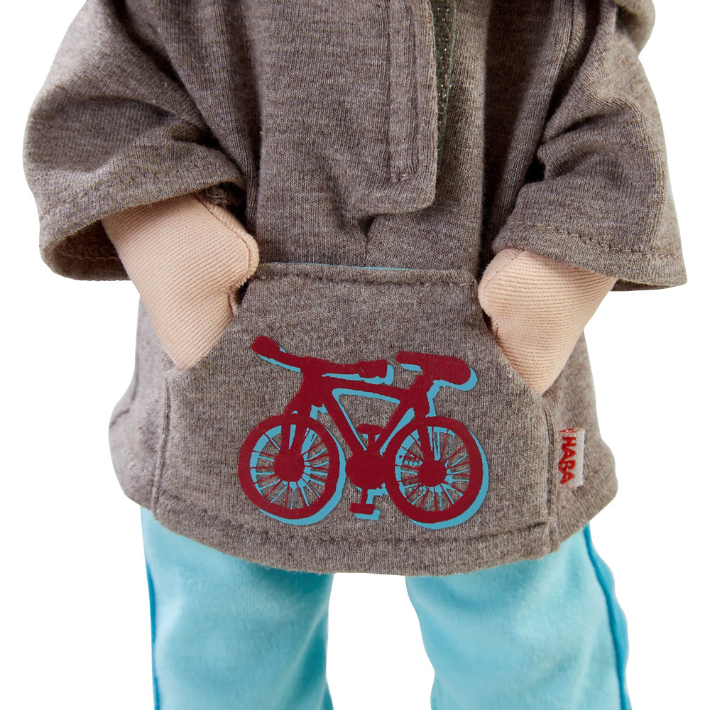 HABA Lian's grey hoodie with bicycle logo inspires dress-up stories.