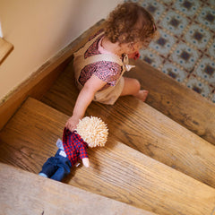 HABA Nick doll with beanbag bottom supports upright sitting.
