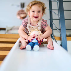 HABA Nick 12-inch doll seated position demonstrates sturdy design.
