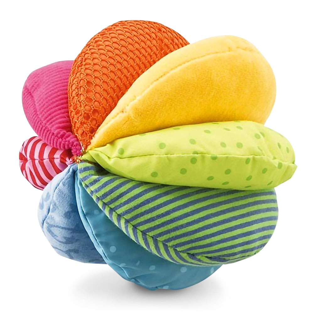 HABA Rainbow Baby Ball closeup textures shows soft fabric and crinkle for sensory exploration.