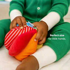 HABA Rainbow Baby Ball six-inch size fits tiny hands for rolling and reaching.
