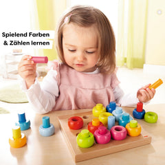 HABA Rainbow Whirls rings collection, vibrant colors for color sorting and pattern exploration.