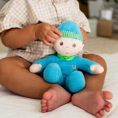 HABA Snug-Up Luis: doll in small hands sparks imaginative play.