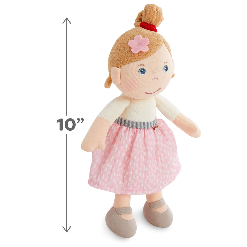 HABA Snug Up Lauren pink flower in hair for a sweet, gentle look.