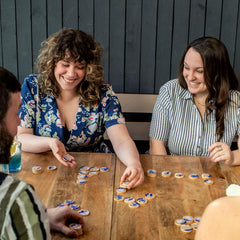 Hachette Seaside wooden tokens close-up, durable and tactile for family play